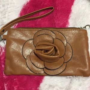 Brown clutch with flower